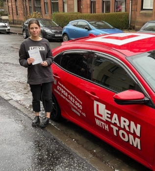 Katie learned to drive with Tom